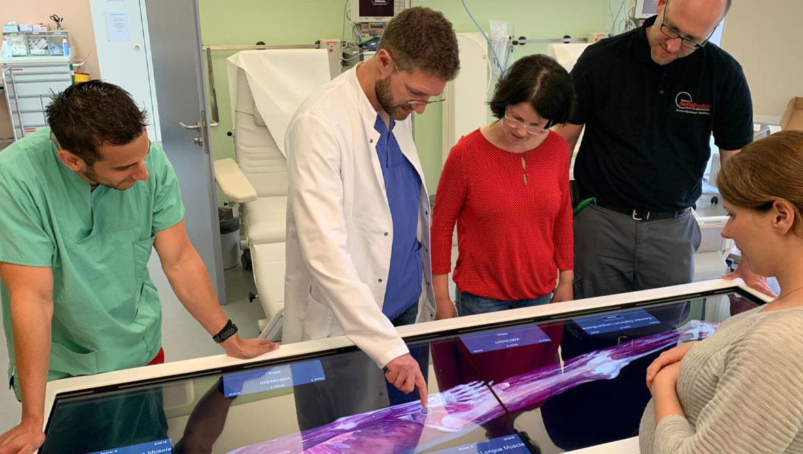 Medical professionals utilizing our virtual dissection table in a cadaver lab environment.