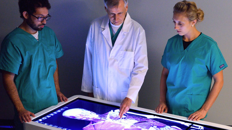 Medical workers using Anatomage’s 3D Anatomy technology to support surgical training and procedure planning.
