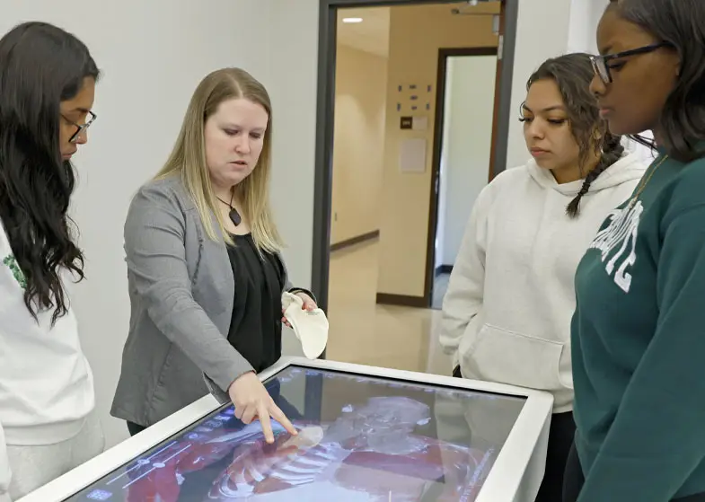 Students exploring 3D anatomical concepts necessary for spatial understanding and hands-on exploration of anatomy and physiology.