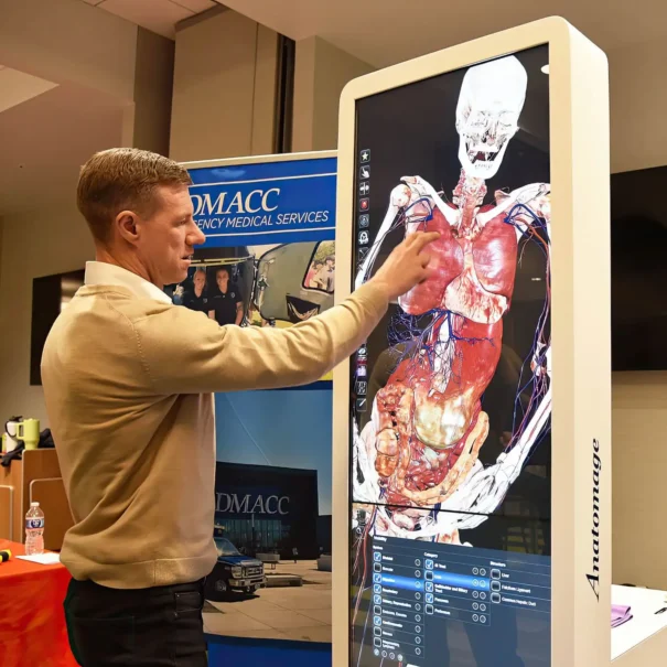Instructor demonstrating how to use the Anatomage Table Convertible.