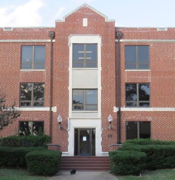 An academic building at Prairie View A&M University, featuring large windows and landscaped bushes, part of the campus’s educational facilities.