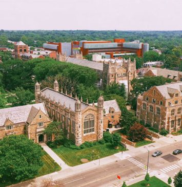 Aerial view of University of Michigan campus featuring historic Gothic-style academic buildings surrounded by trees, showcasing the university’s extensive educational facilities and STEM learning environment.